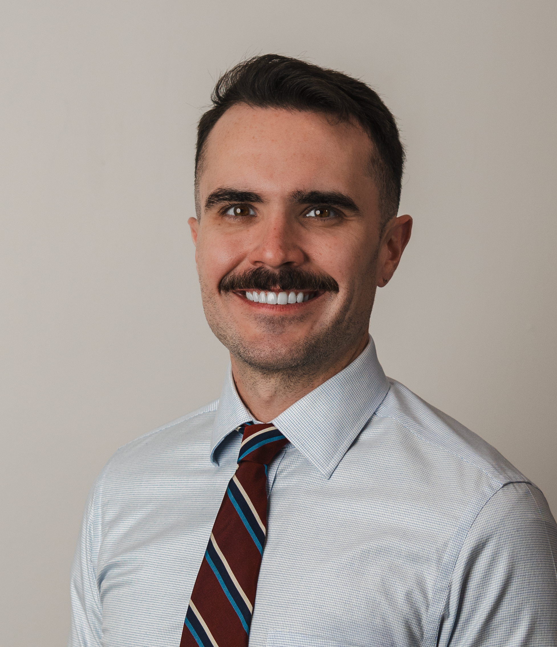 A professional headshot of Jason Gates.